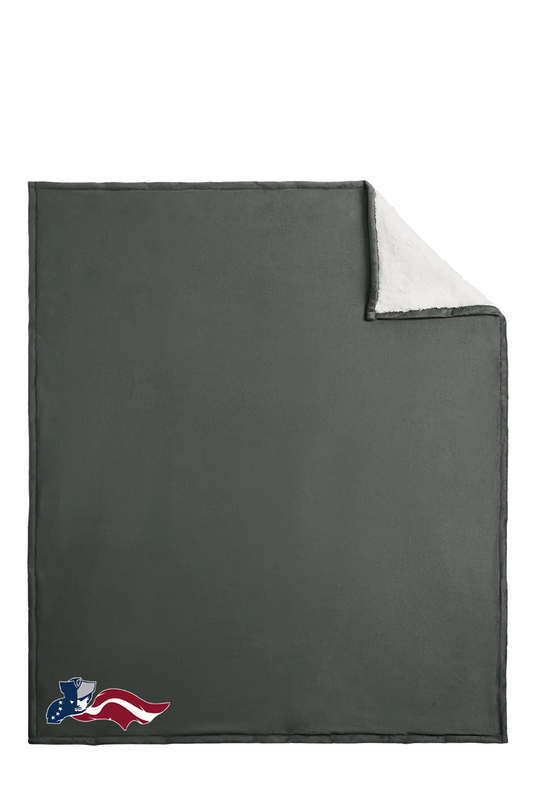 Gray blanket with a corner folded over, featuring an American flag logo in the corner. Paper Street Print Co, Blairstown, NJ.