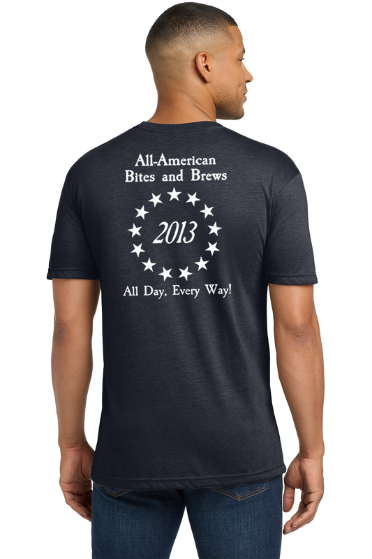 Man wearing a black t-shirt with white text on the back, standing against a white background. Paper Street Print Co, Blairstown, NJ.