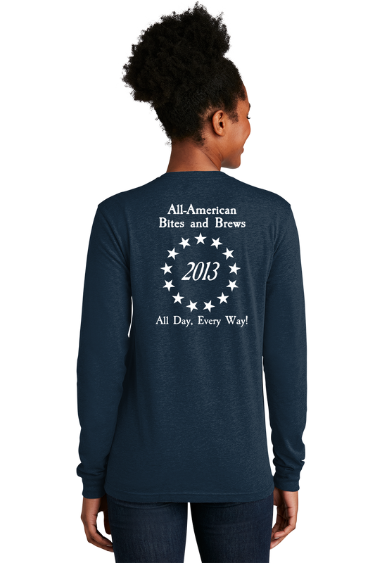 Navy long-sleeve shirt with text on the back worn by a person, on a white background. Paper Street Print Co, Blairstown, NJ,