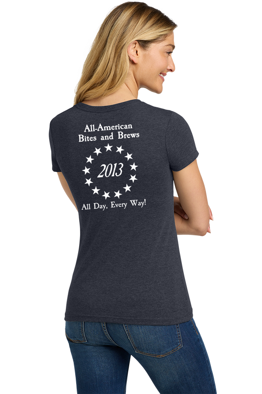 Woman wearing a dark gray t-shirt with text on the back, standing against a white background. Paper Street Print Co, Blairstown, NJ,