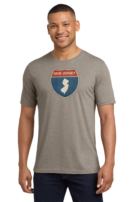 Man wearing a gray t-shirt with a New Jersey graphic design on a white background - Paper Street Print Co, Blairstown, NJ