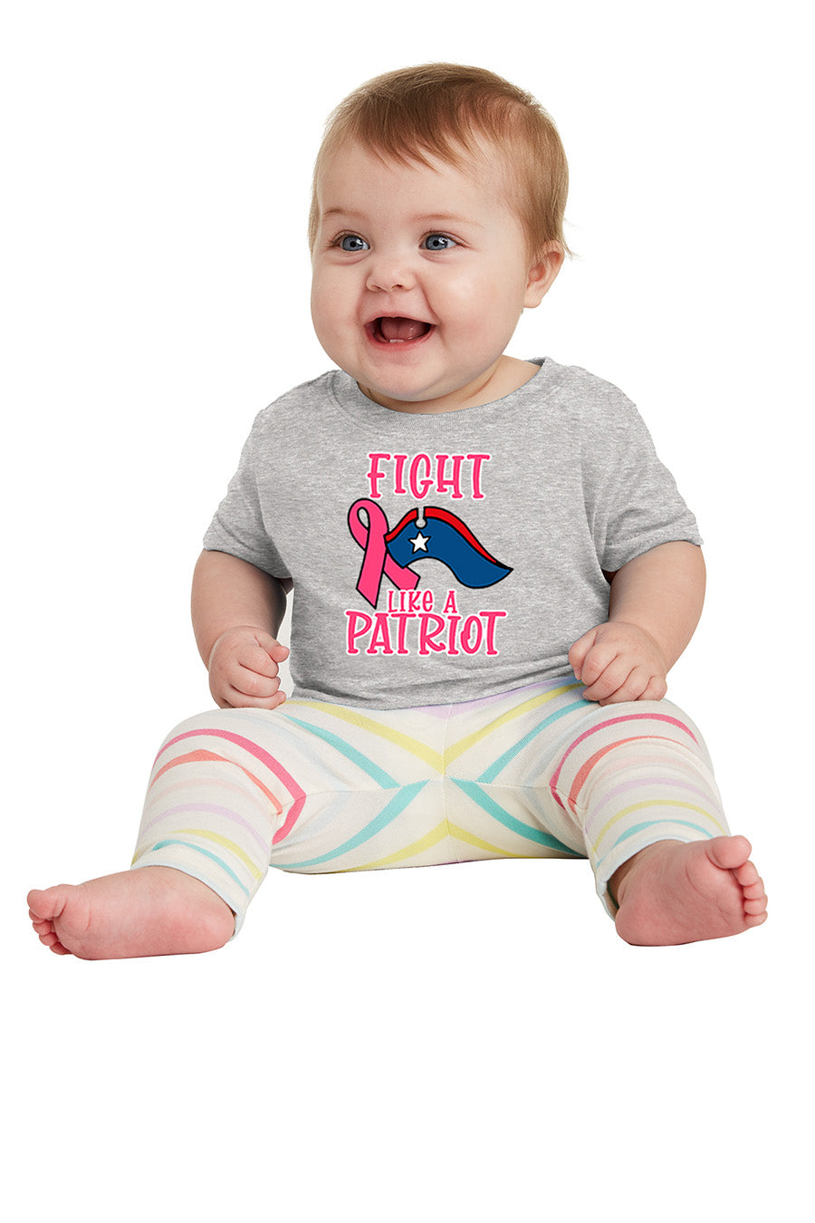 Baby wearing a onesie with 'Fight Like a Patriot' text and pink ribbon design on a white background. Paper Street Print Co, Blairstown, NJ.