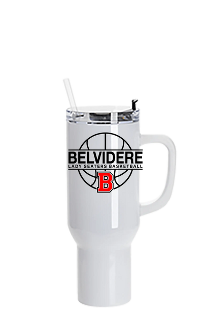 A white insulated travel tumbler with a handle and clear lid, featuring a black basketball graphic and the text 'BELVIDERE LADY SEATERS BASKETBALL' with a red 'B' logo on the front. Paper Street Print Co, Blairstown, NJ.