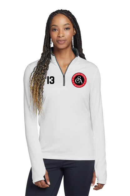 Woman wearing a white pullover with a logo and number on a white background. Paper Street Print Co, Blairstown, NJ.