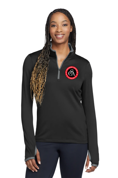 Woman wearing a black long-sleeve shirt with a logo on a white background. Paper Street Print Co, Blairstown, NJ.