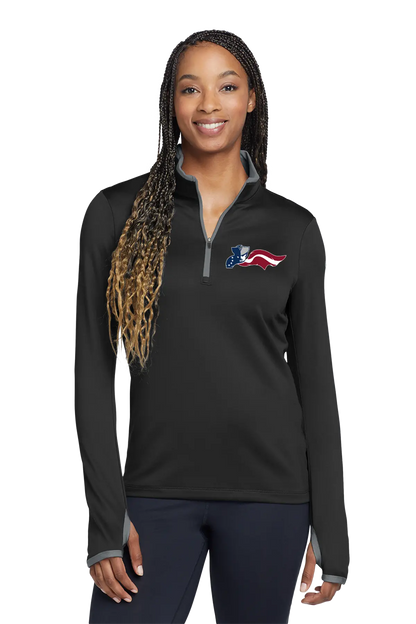 Woman wearing a black long-sleeve shirt with an American flag logo on a white background. Paper Street Print Co, Blairstown, NJ.