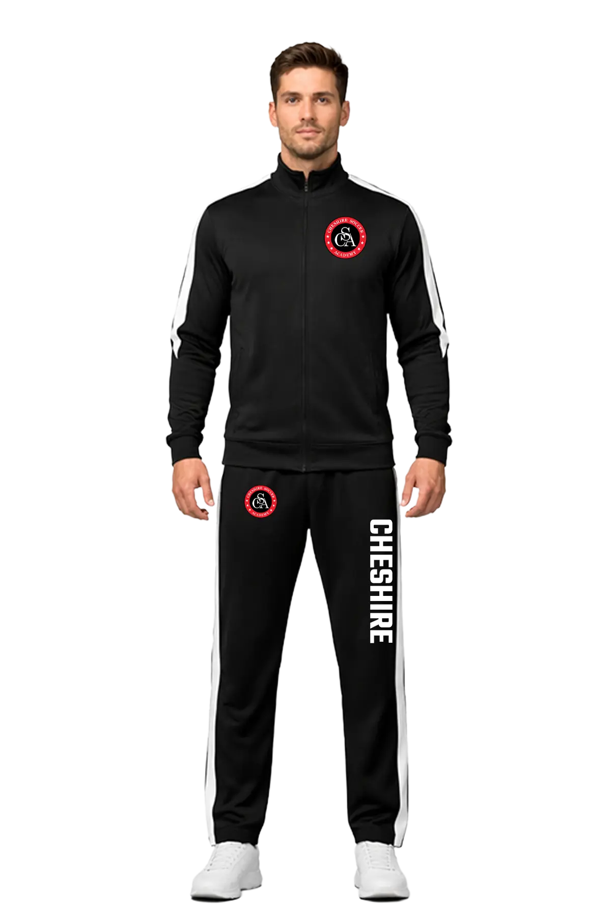 Man wearing a black tracksuit with 'Cheshire' branding on a white background. CSA Cheshire Soccer Academy, Paper Street Print Co, Blairstown, NJ.