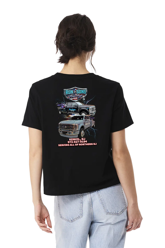 Person wearing a black t-shirt with graphics and text on the back, standing against a white background. Ron and Sons Towing, Paper Street Print Co, Blairstown, NJ.