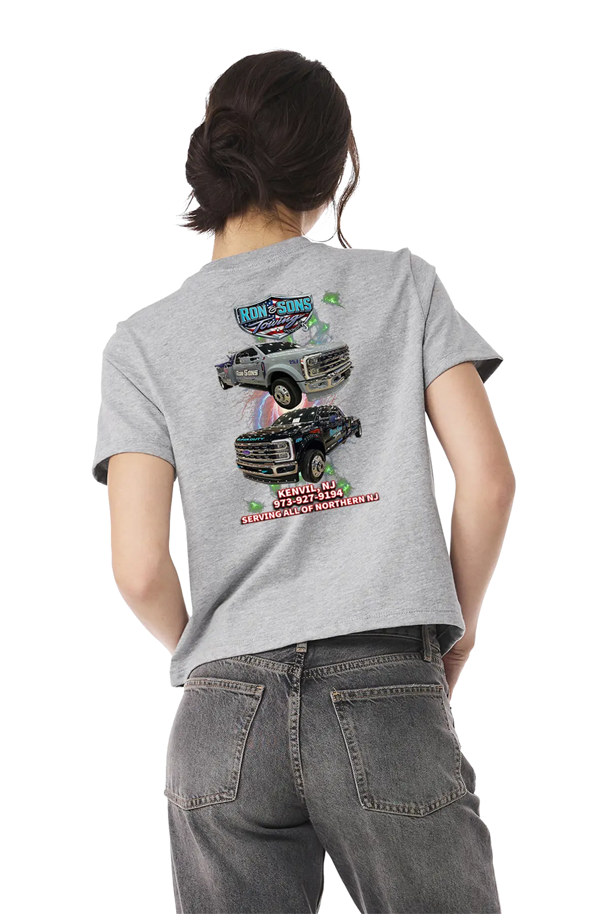 Person wearing a gray t-shirt with graphic designs on the back, standing against a white background. Ron and Sons Towing, Paper Street Print Co, Blairstown, NJ.