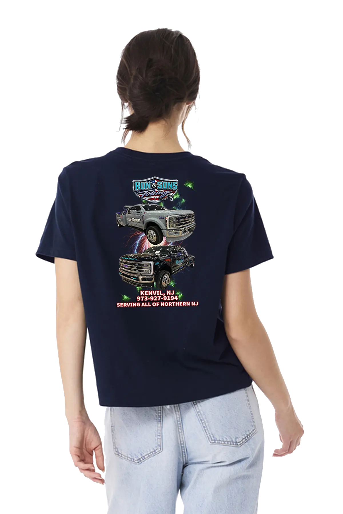 Person wearing a navy blue t-shirt with graphic designs on the back, standing against a white background. Ron and Sons Towing, Paper Street Print Co, Blairstown, NJ.