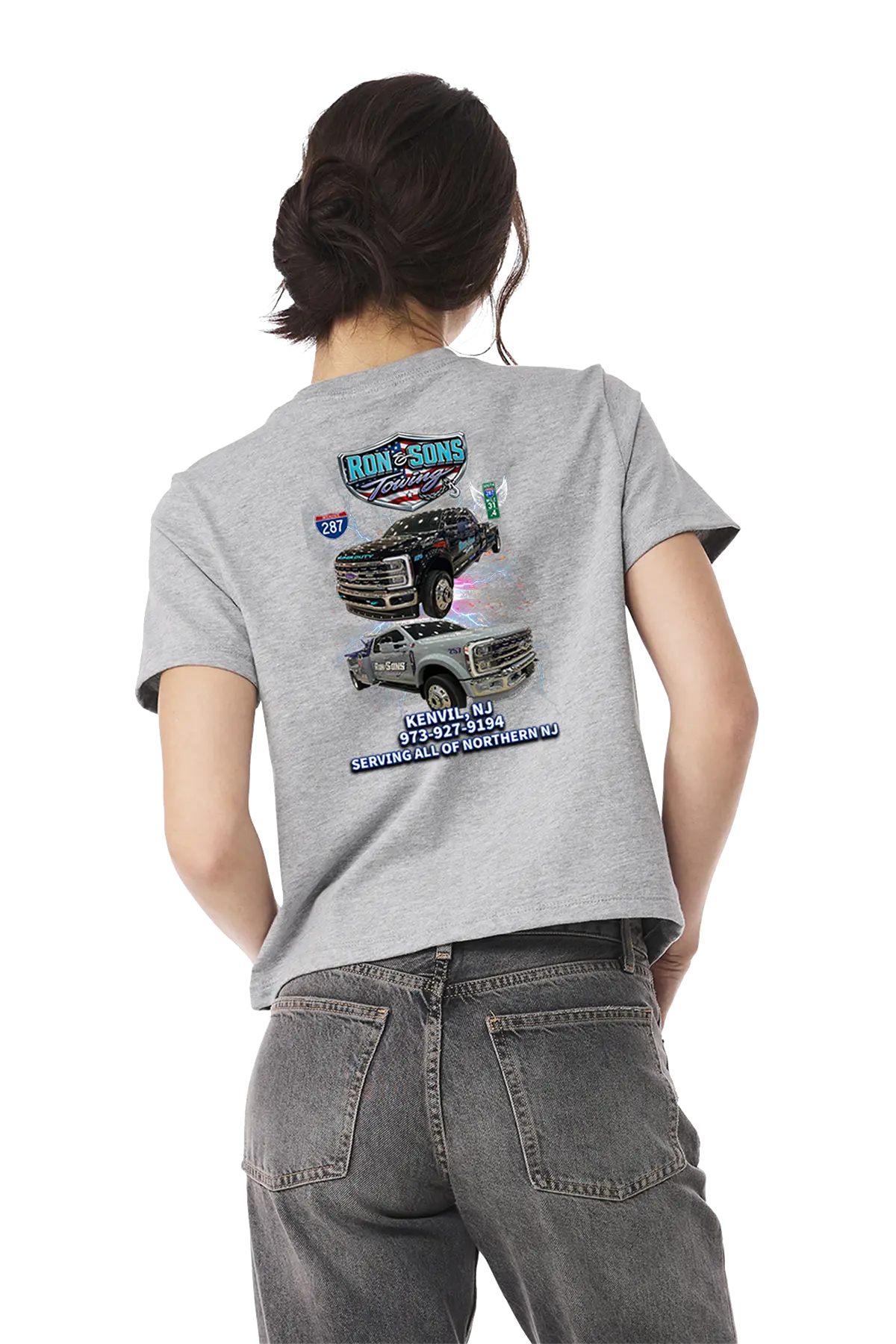 Person wearing a gray t-shirt with truck graphics on the back, standing against a white background. Ron and Sons Towing, Paper Street Print Co, Blairstown, NJ.