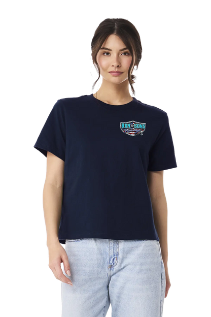 Woman wearing a navy blue t-shirt with a logo on a white background. Ron and Sons Towing, Paper Street Print Co, Blairstown, NJ.