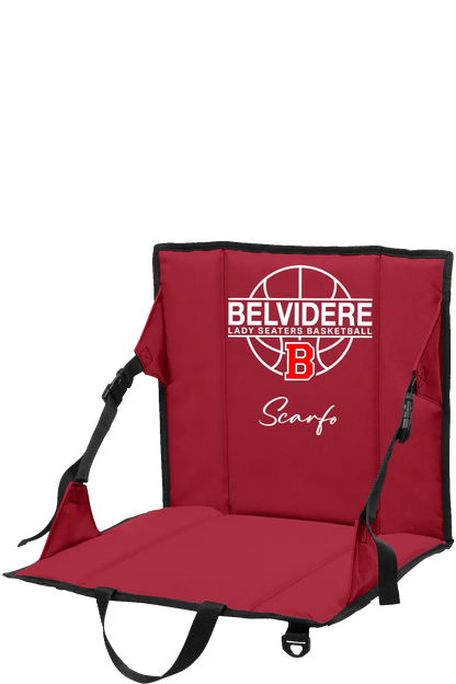 A red portable folding stadium chair with black straps and trim, featuring a white and red 'Belvidere Lady Seaters Basketball' logo and the name 'Scarfo' printed on the backrest, shown against a plain white background. Paper Street Print Co, Blairstown, NJ.