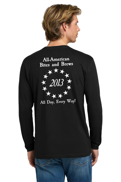 Person wearing a black long-sleeve shirt with text on the back, standing against a white background. Paper Street Print Co, Blairstown, NJ,