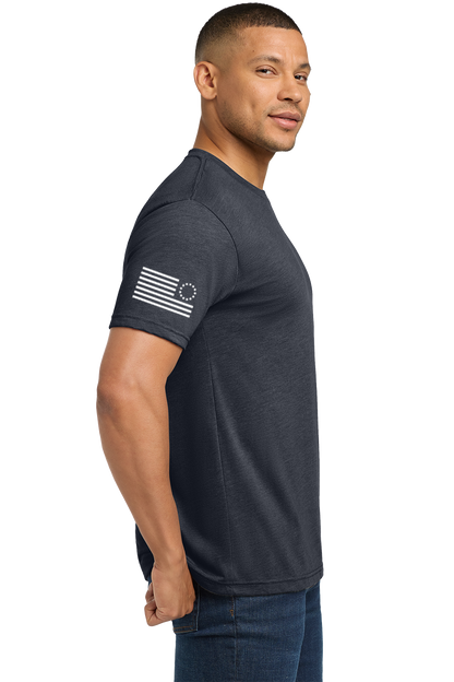 Man wearing a dark gray t-shirt with a flag design on a white background. Paper Street Print Co, Blairstown, NJ.
