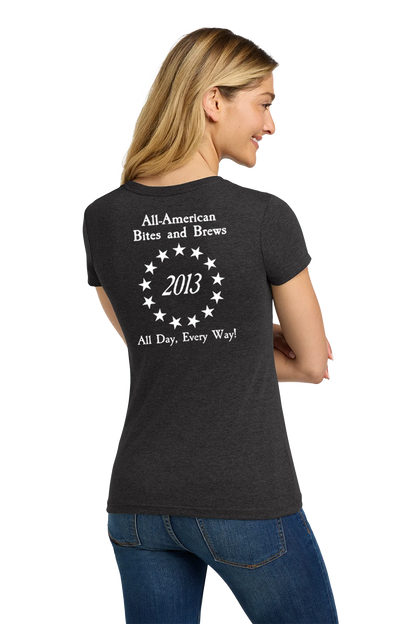 Woman wearing a black t-shirt with text on the back, standing against a white background. Paper Street Print Co, Blairstown, NJ.