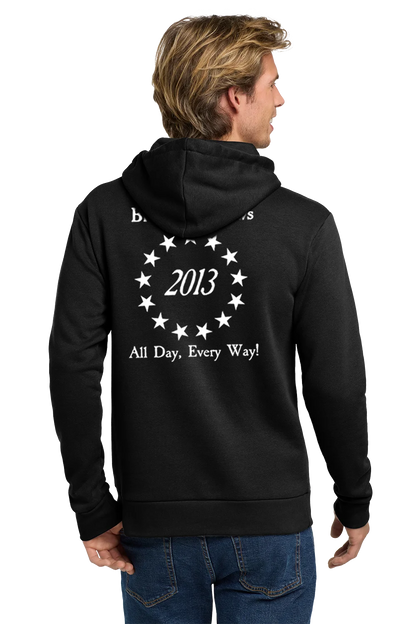 Person wearing a black hoodie with text on the back, standing against a white background. Paper Street Print Co, Blairstown, NJ.