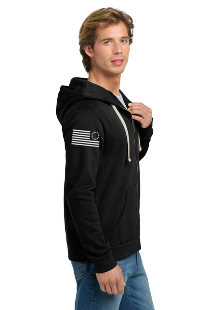 Man wearing a black hoodie with a flag design on a white background. Paper Street Print Co, Blairstown, NJ,