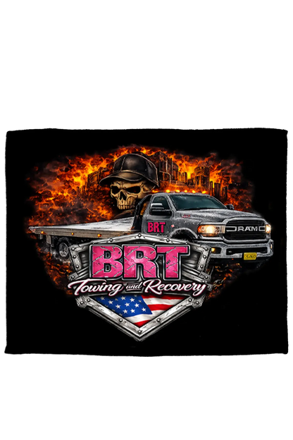 Fleece blanket with BRT Towing and Recovery logo featuring a truck and skull design on a black background. Paper Street Print Co., Blairstown, NJ.