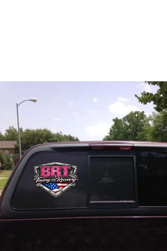 Back of a vehicle with a 'BRT Towing & Recovery' decal on a clear day. Paper Street Print Co, Blairstown, NJ.