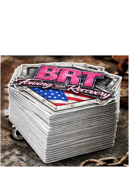 Stack of stickers with 'BRT Towing and Recovery' logo on a textured surface, stack of 50 stickers. Paper Street Print Co, Blairstown, NJ.