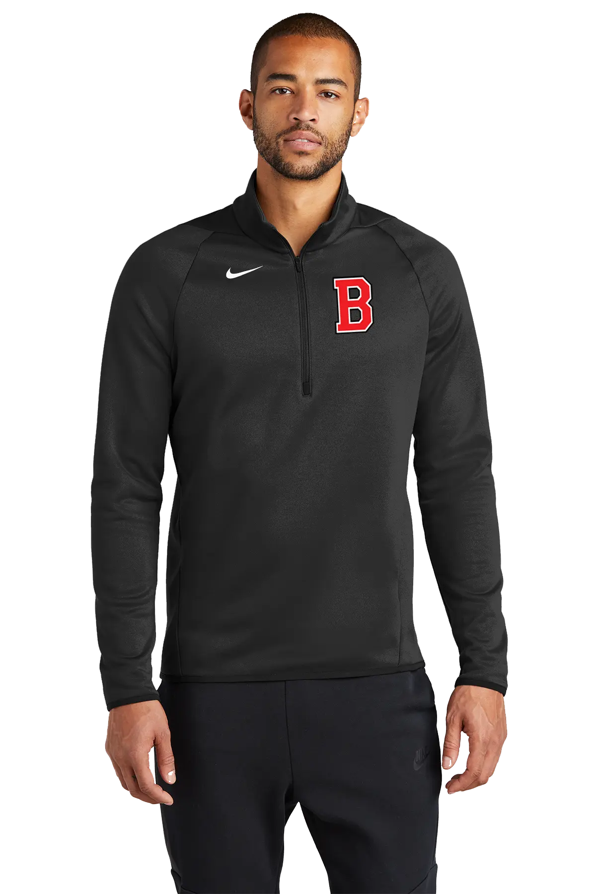 A man wearing a black Nike half-zip pullover with a red letter 'B' on the chest, photographed against a plain white background. Belvidere Lady Seaters Basketball, Paper Street Print Co, Blairstown, NJ.