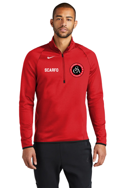 Man wearing a red Nike sports jacket with branding on a white background. Paper Street Print Co, Blairstown, NJ.