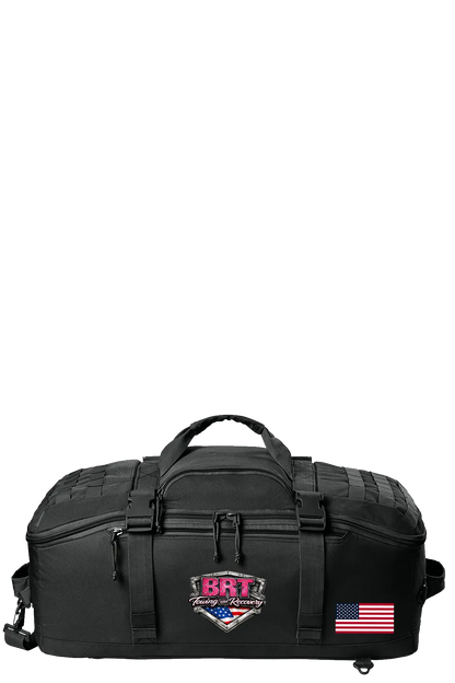 Black tactical bag with visible branding and an American flag on a white background. BRT Towing & Recovery, Paper Street Print Co, Blairstown, NJ.