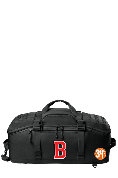 A black duffel bag with a large red letter 'B' on the front and an orange circular '31' patch on the side, shown against a plain white background. Belvidere Lady Seaters, Paper Street Print Co, Blairstown, NJ.