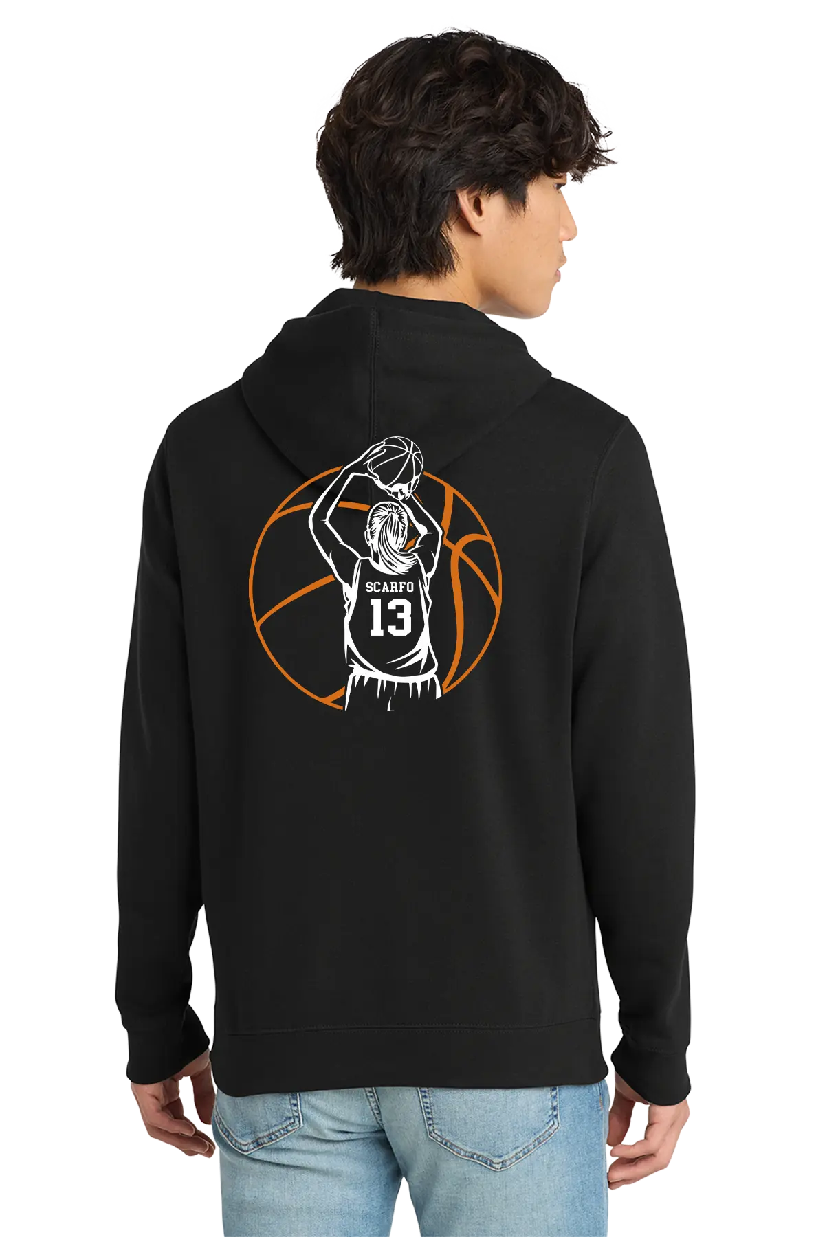 A man wearing a black hoodie from the back, featuring a white and orange basketball player graphic with the number 13 on the back, paired with light blue jeans against a white background.. Belvidere Lady Seaters, Paper Street Print Co, Blairstown, NJ.