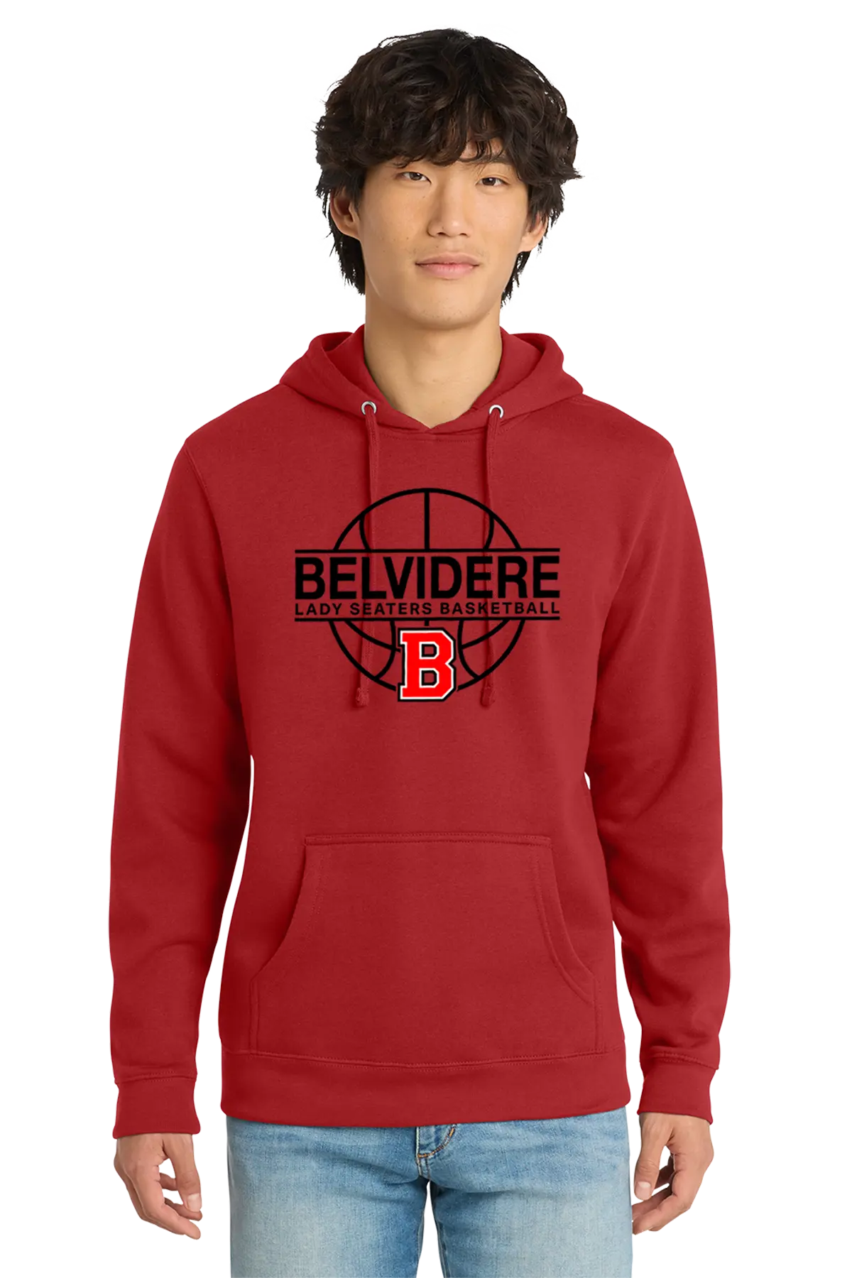 A man wearing a red pullover hoodie with a black and red 'BELVIDERE LADY SEATERS BASKETBALL' graphic on the chest, paired with light blue jeans, against a plain white background. Paper Street Print Co, Blairstown, NJ.