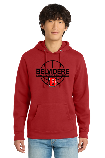 A man wearing a red pullover hoodie with a black and red 'BELVIDERE LADY SEATERS BASKETBALL' graphic on the chest, paired with light blue jeans, against a plain white background. Paper Street Print Co, Blairstown, NJ.