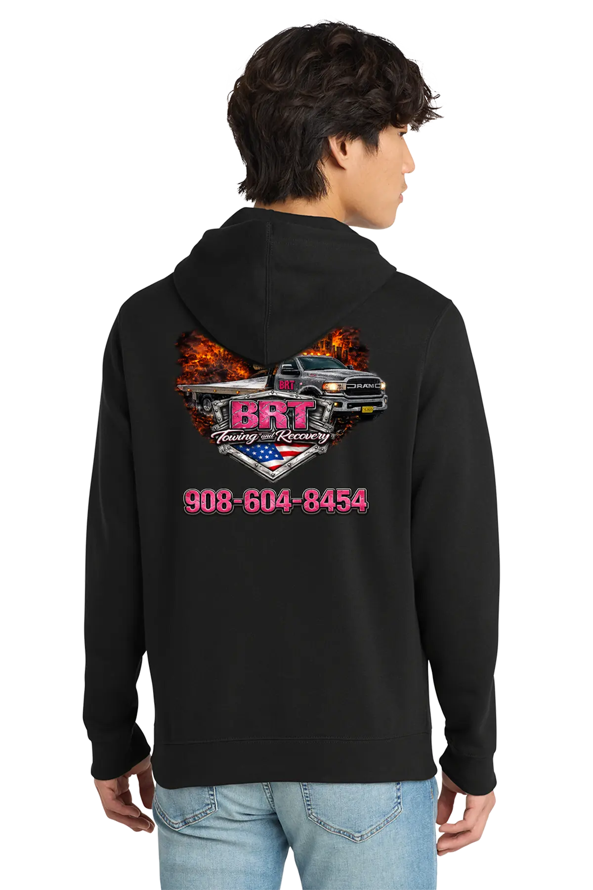 Person wearing a black hoodie with a graphic design and text on the back. BRT Towing & Recovery, Paper Street Print Co, Blairstown, NJ.