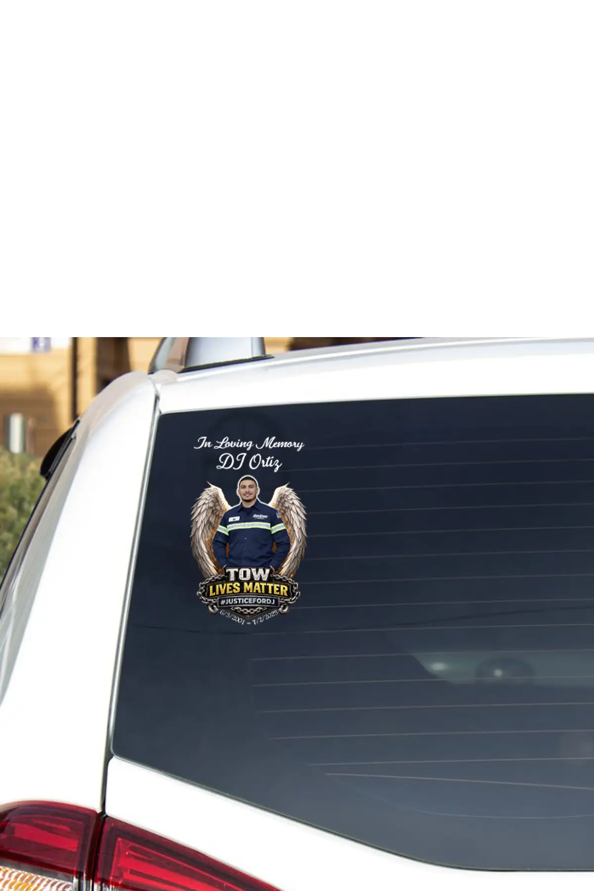 Car window with a memorial decal for DJ Ortiz on a white background, #JusticeforDJ TOW Lives Matter - Paper Street Print Co, Blairstown, NJ.
