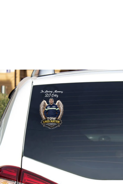 Car window with a memorial decal for DJ Ortiz on a white background, #JusticeforDJ TOW Lives Matter - Paper Street Print Co, Blairstown, NJ.