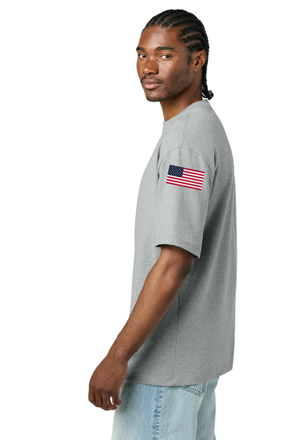 Man wearing a gray t-shirt with an American flag on a white background. BRT Towing and Recovery, Paper Street Print Co, Blairstown, NJ.