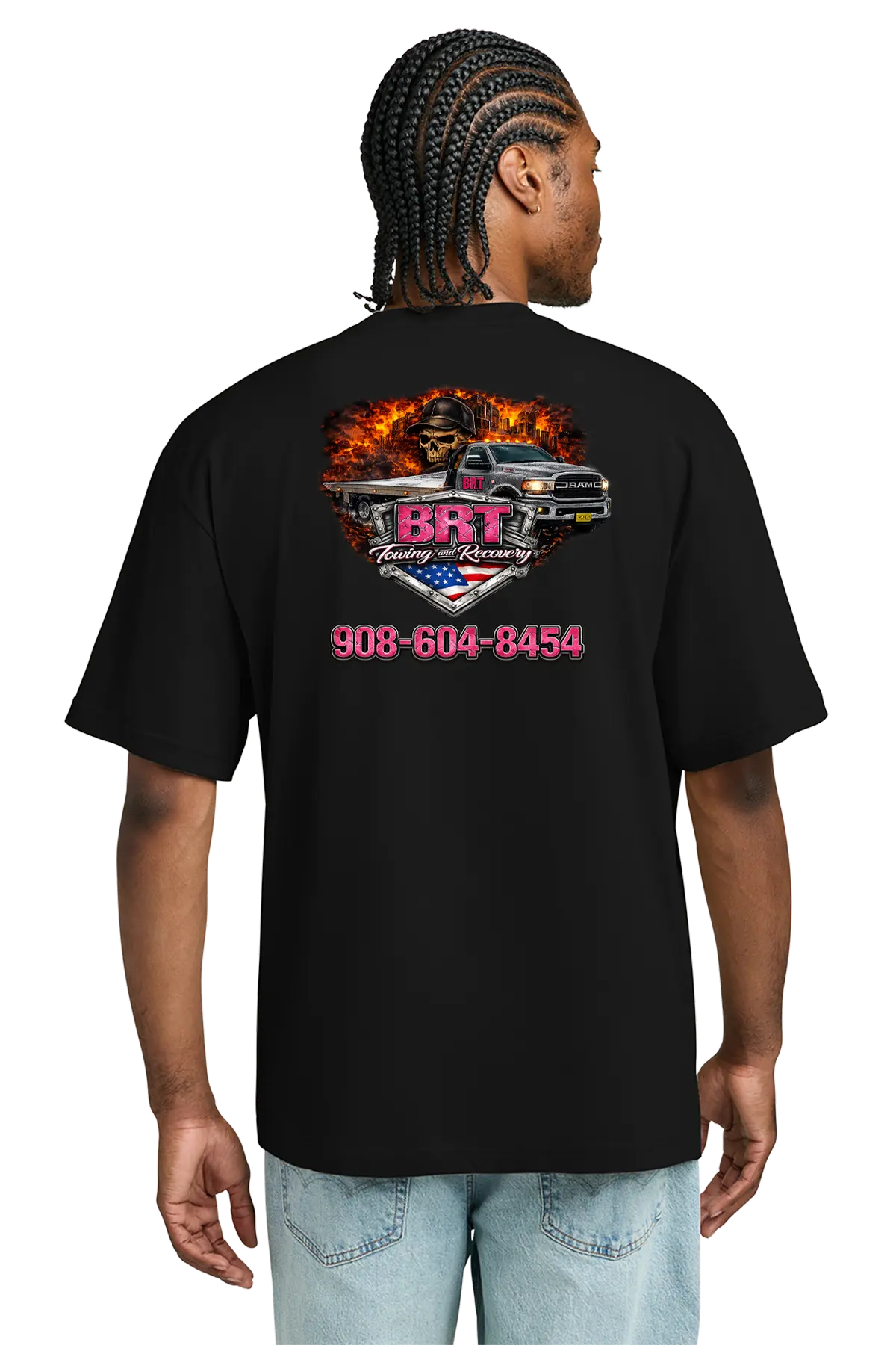 Person wearing a black t-shirt with a graphic design and contact information on the back. BRT Towing and Recovery, Paper Street Print Co, Blairstown, NJ.