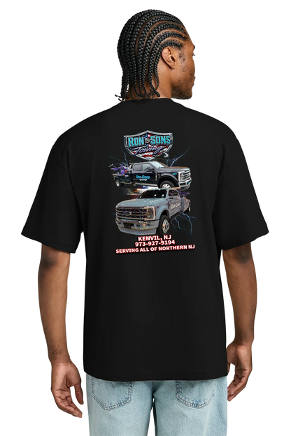 Person wearing a black t-shirt with graphics and text on the back, standing against a white background. Ron and Sons Towing, Paper Street Print Co, Blairstown, NJ.