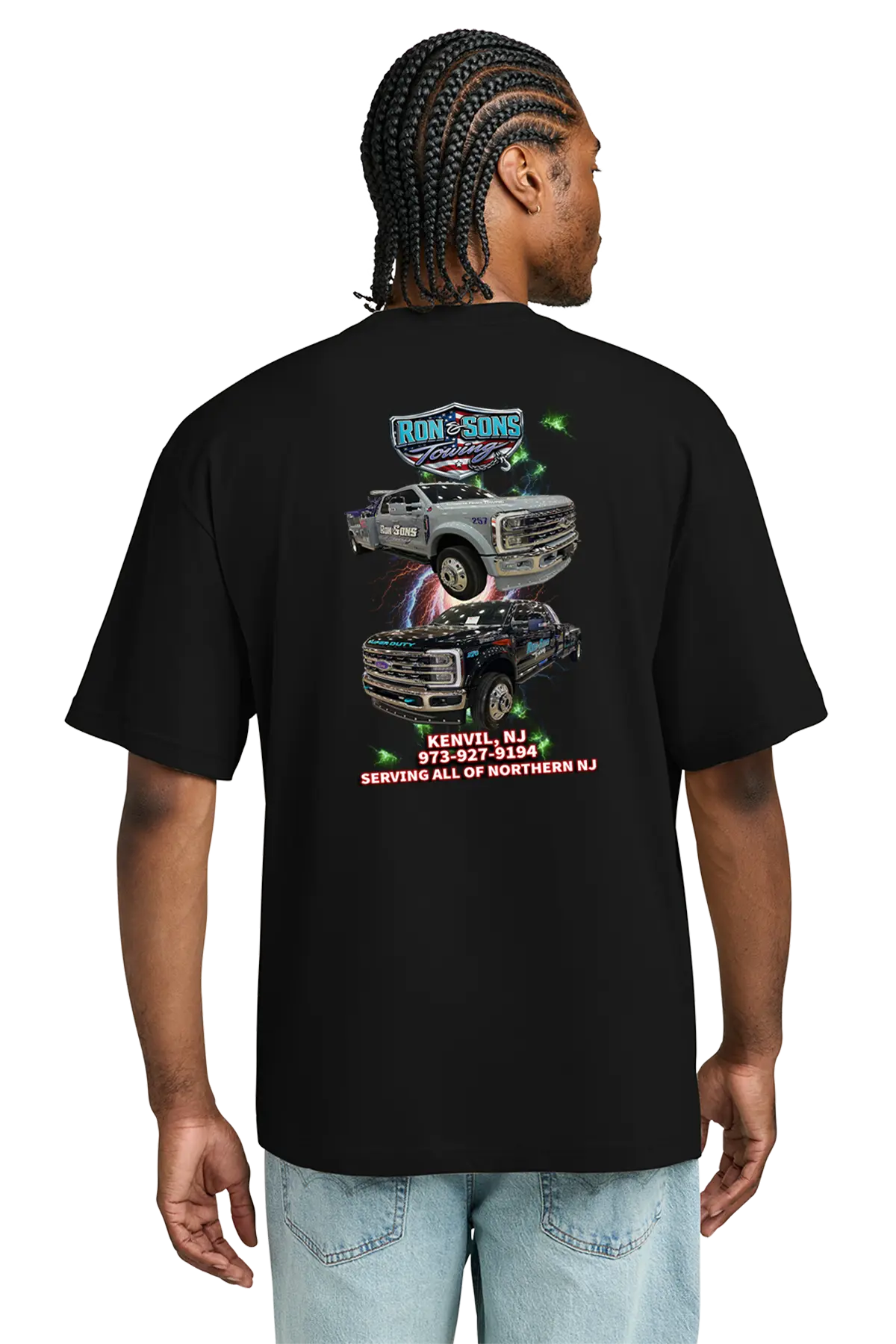 Person wearing a black t-shirt with graphics and text on the back. Ron and Sons Towing, Paper Street Print Co, Blairstown, NJ.