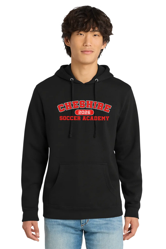 Person wearing a red hoodie with 'Cheshire Soccer Academy 2026' text on a white background. Paper Street Print Co, Blairstown, NJ.
