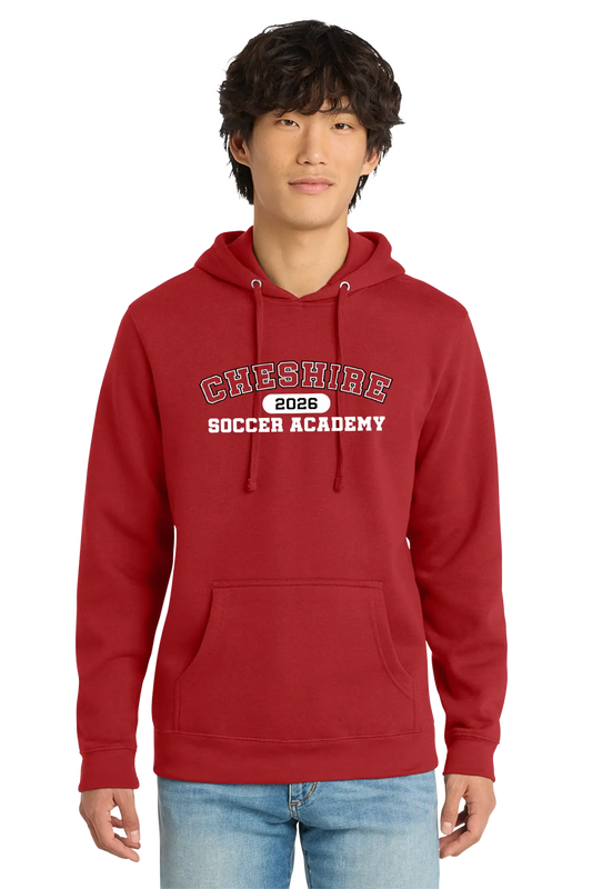 Person wearing a red hoodie with 'Cheshire Soccer Academy 2026' text on a white background. Paper Street Print Co, Blairstown, NJ.
