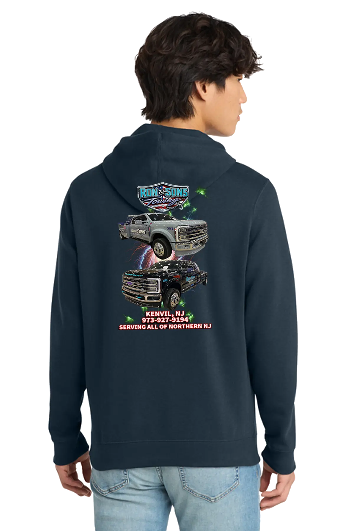 Person wearing a navy hoodie with graphic designs on the back, standing against a white background. Ron and Sons Towing, Paper Street Print Co, Blairstown, NJ.