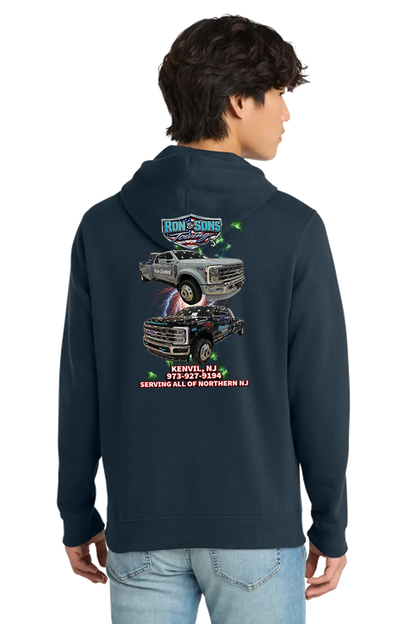 Person wearing a navy hoodie with graphic designs on the back, standing against a white background. Ron and Sons Towing, Paper Street Print Co, Blairstown, NJ.