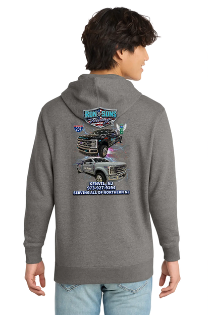 Person wearing a gray hoodie with a graphic design on the back, standing against a white background. Ron and Sons Towing, Paper Street Print Co, Blairstown, NJ.