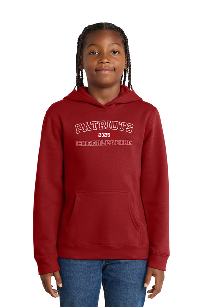 Person wearing a red hoodie with 'Patriots 2023 Cheerleading' text on a white background. Paper Street Print Co, Blairstown, NJ.