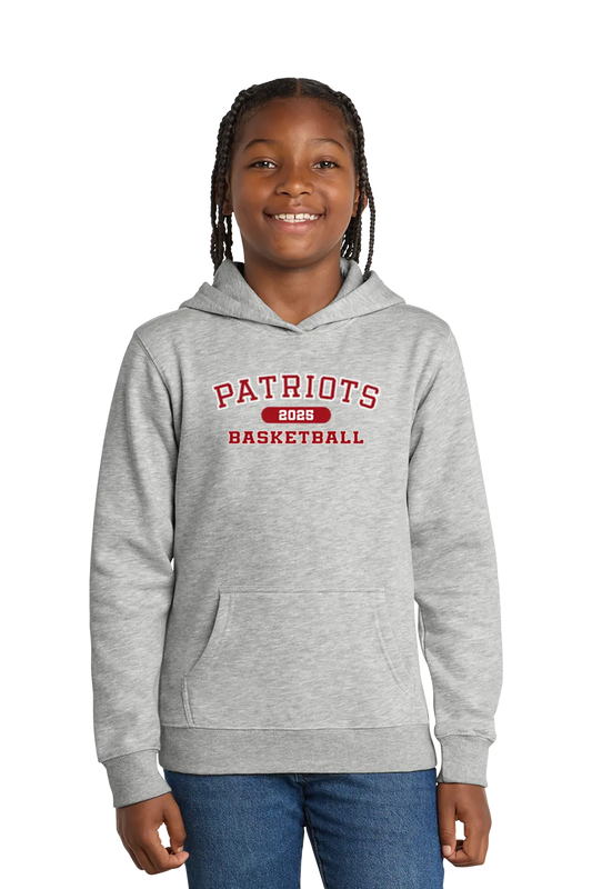 Girl wearing a gray hoodie with 'Patriots Basketball' text on a white background. Paper Street Print Co, Blairstown, NJ.