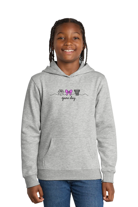 Girl wearing a gray hoodie with a design on a white background. Paper Street Print Co, Blairstown, NJ.