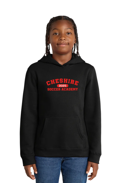 Person wearing a black hoodie with 'Cheshire Soccer Academy' text on a white background. Paper Street Print Co, Blairstown, NJ.
