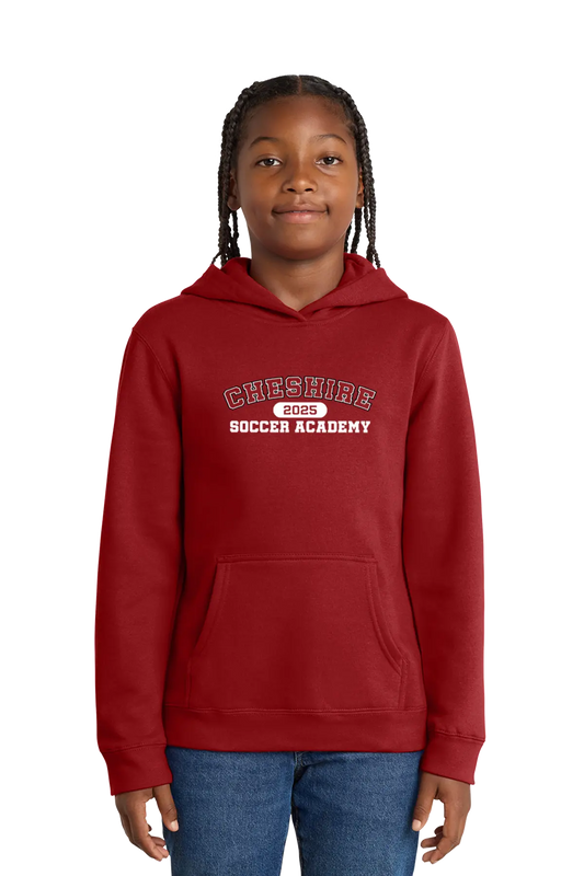 Person wearing a red hoodie with 'Cheshire Soccer Academy' text on a white background. Paper Street Print Co, Blairstown, NJ.