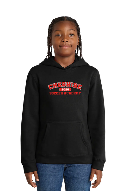 Person wearing a black hoodie with 'Cheshire Soccer Academy' text on a white background. Paper Street Print Co, Blairstown, NJ.